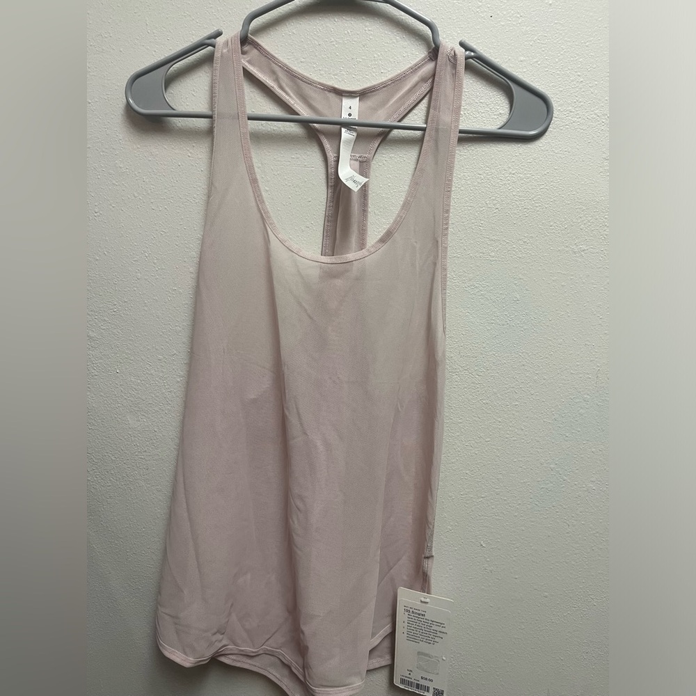 Lululemon pink mesh workout top. Never been worn.